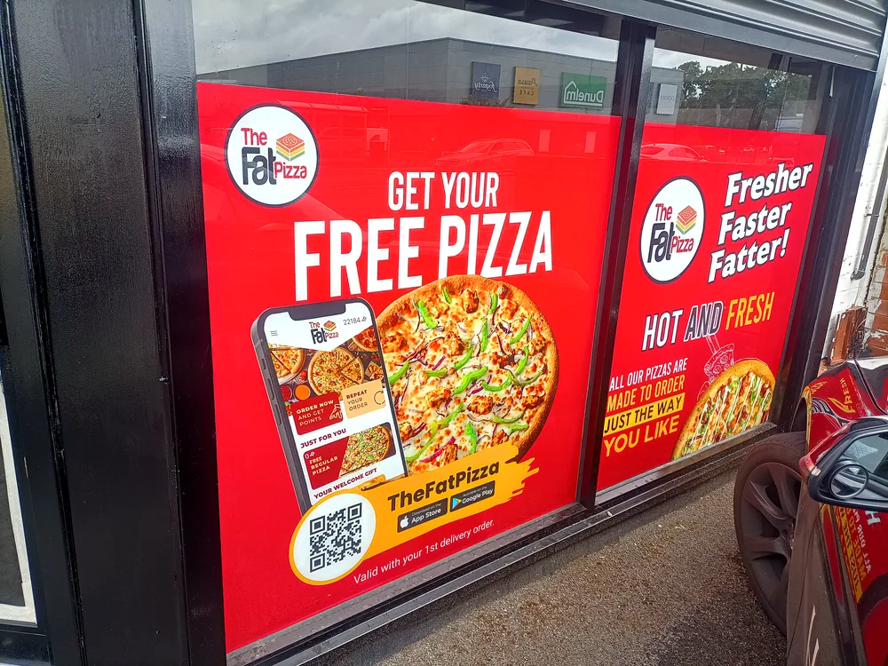 Free Pizza — printed promotional banner by New Smart Signs