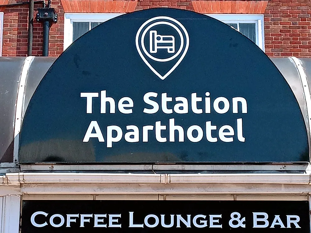 The Station Aparthotel — premium building signage by New Smart Signs