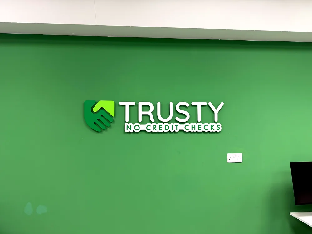 Trusty — illuminated green fascia sign by New Smart Signs